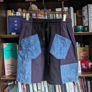 Alexander McQueen "McQ" patchwork denim and sweatpant material mini skirt